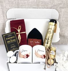 an open gift box filled with personal items