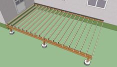 an image of a wooden deck being built in the yard with wheels attached to it