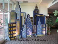 the city skyline is made out of cardboard