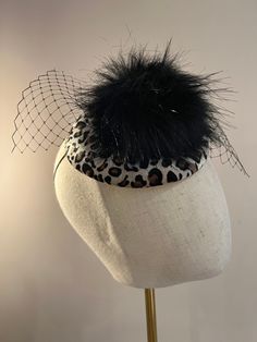 This beautiful fascinator features a contrasting black fluff pom pom & birdcage veil positioned on a leopard animal print felt fascinator. Complete with an elastic hat band to secure in place. This stunning fascinator is perfect for any formal occasion, weddings and races. Brand New. The felt fascinator measures approximately 15cm in diameter. If you need your item by a certain date please let me know. Made in the UK. Custom orders are welcome. Many more items are available in our Shop. Returns Please notify us within 3 days of receiving your item if you intend to return it. We allow 7 days from the date of receipt of the headpiece to return it to us, our returns requirements are that it is returned properly packaged to prevent damage in the post, it is unworn/as new condition and has not Black Birdcage Veils, Felt Fascinator, Hat Wedding, Birdcage Veil, Fascinator Hat, Leopard Animal, Fascinator Hats, Hat Band, Bird Cage