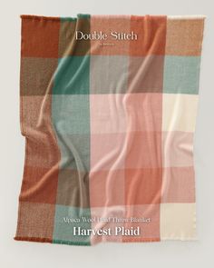 an orange, pink and green plaid blanket with the words double - stitch on it