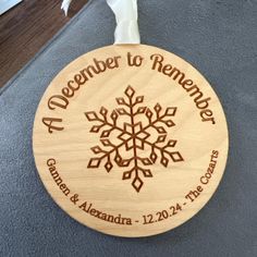 a wooden ornament with a snowflake on it