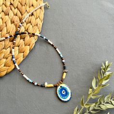 🌟 Designed for those who like to be original and looking for unique jewelry  ✅ Each piece is hand-shaped and drawn by us, making it wonderfully unique--so, expect a bit of delightful variation from the pictures 🍀 Because of their handmade charm, every ceramic piece is entirely one-of-a-kind. These high-quality creations are made to last, just like the memories you'll create with them!  🎁 It is suitable for every day , it can also be purchased as a perfect gift for special days like Valentine's Day, Mother's Day, Christmas or Birthday gift 🧿 Turkish evil eye  The evil eye symbolizes protection from bad energy and envy in Turkish and Middle Eastern culture The evil eye bead is believed to bring good vibes and good luck, we hope it will give you the same feeling! 📦 Packing :  All necklac Hand Painted Adjustable Teardrop Jewelry, Handmade Amulet Necklace With Round Beads, Handmade Amulet Style Necklace With Round Beads, Handmade Symbolic Round Pendant Jewelry, Unique Pendant Necklace For Souvenirs, Handmade Amulet Jewelry Souvenir, Handmade Artsy Blue Jewelry, Handmade Amulet Jewelry As Souvenir, Handmade Artistic Beaded Necklaces