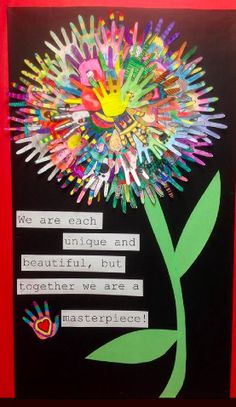 a bulletin board with some writing on it and a flower made out of crayons