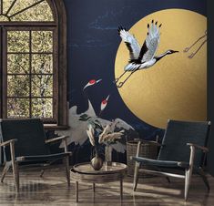 two birds flying in front of a full moon wallpapered living room with chairs