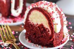 a chocolate cake with white frosting is cut in half