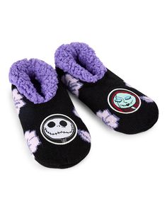 the slippers are black and purple with skulls on them