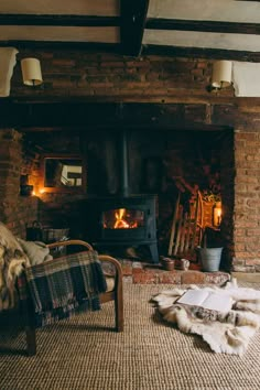 a living room with a fire place next to a chair and rug on the floor