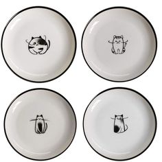 four black and white plates with cats drawn on the front one has a cat's head