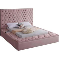 a pink bed with white sheets and pillows on it's headboard, in front of a white background