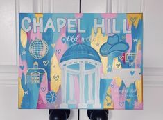 there is a painting on the wall that says chapel hill and it's blue dome