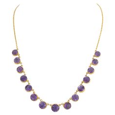 Antique 9 Karat and Natural Amethyst Graduated Rivière Necklace L 43.7 cm x W 0.98 cm / 17.2 in. x 0.39 in. Large Center Stone: W 0.985 cm x 0.985 cm / 0.39 in. x 0.39 in. Smallest Stone: W 0.743 cm x 0.743 cm / 0.293 in. x 0.293 in. 13.1 grams Chains Necklace, Amethyst, Jewelry Necklaces, Chain, Purple, For Sale