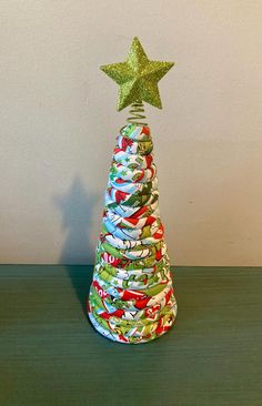 a christmas tree made out of cloth with a star on top