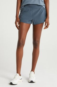 Built to handle all your workouts or hangouts, inside or out, these shorts are cut from a lightweight, UV-protective fabric with four-way stretch for easy movement. Pull-on style Side-zip pocket UPF 50+ sun protection Partially lined 86% recycled polyester, 14% spandex Machine wash, line dry Imported Nylon Athleisure Skort For Gym, Summer Training Bottoms With Built-in Shorts, Casual Training Skort With Built-in Shorts, Moisture-wicking Short Length Skort For Yoga, Athleisure Nylon Skort With Built-in Shorts, Moisture-wicking Short Skort For Yoga, Moisture-wicking Short Skort For Workout, Sportswear Workout Shorts In Recycled Polyester, Nylon Workout Skort With Built-in Shorts