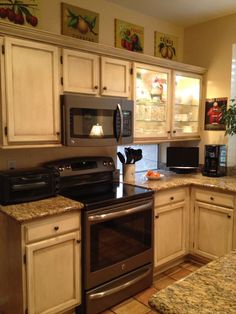 a kitchen with granite counter tops and stainless steel appliances