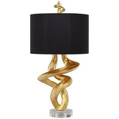 a table lamp with a black shade on it and a gold twisted design in the middle