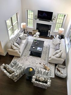 an aerial view of a living room with couches and chairs