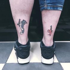 two people with matching tattoos on their legs