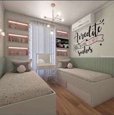 two beds in a room with white walls and wooden floors