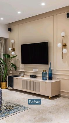 a living room filled with furniture and a flat screen tv on top of a wall