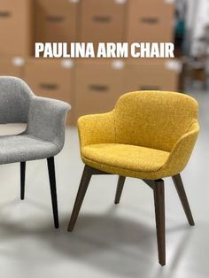 two chairs sitting next to each other with boxes in the background and text that reads, paulina arm chair