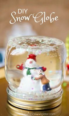 a snow globe with a couple in it and the words diy snow globe on top