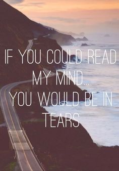 a road with the ocean in the background and a quote on it that says if you could read my mind, you would be in tears