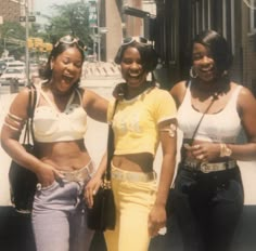 three young women standing next to each other