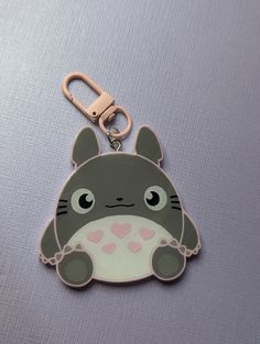 a key chain with a totoro design on it