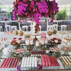 a table filled with lots of different types of desserts