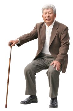 an old man sitting on top of a wooden stick