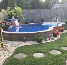 an above ground pool surrounded by landscaping