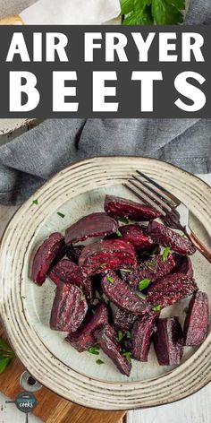 roasted beets on a plate with a fork and knife