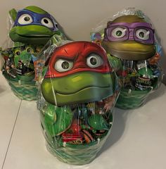 teenage mutant ninja turtles wrapped in plastic and sitting next to each other on a counter