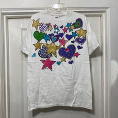 Vintage Glitter Paint Stars and Hearts Single Stitch T-shirt Brand is Anvil.  100% cotton.  Made in the USA.  Tag says size large.  The bust measures 21'' flat across armpit to armpit and the length from shoulder seam to bottom along the side is 28''. Stars And Hearts, Tshirt Painting, Puffy Paint, Glitter Paint, Shirt Brand, Gender Neutral, Adult Outfits, Bathing Beauties, Tops & Tees