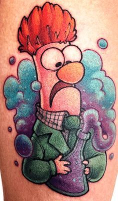 a cartoon character with an orange mohawk on his head is depicted in this tattoo design