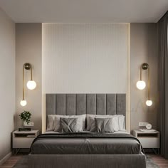 a bedroom with a bed, nightstands and two lamps on either side of the bed