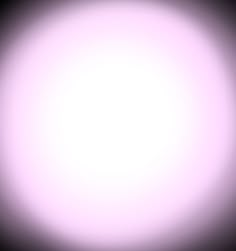 a blurry image of a white light in the middle of dark room with no one around it