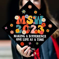 a woman wearing a graduation cap that says msn 2012 making a difference one life at a time