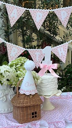 a table topped with a cake and flowers