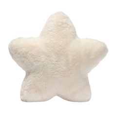 a white star shaped pillow on a white background