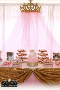 a pink and gold princess themed dessert table