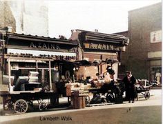 an old photo of people selling items on the street