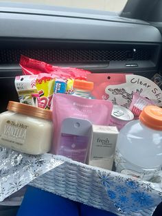 an assortment of personal care products in the back seat of a car