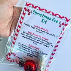 a hand is holding a christmas eve kit