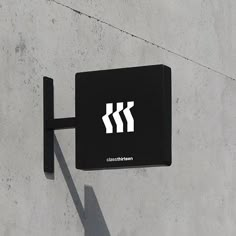 a black and white sign on the side of a building