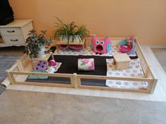 a doll house with furniture and plants in it