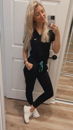 Cute Scrubs For Women, Teal Scrubs Nursing, Black Nurse Scrubs Outfits, Vet Tech Scrubs For Women, Scrubs Tucked In, Black Scrubs Uniform For Women, Black Jogger Scrubs Outfit, Navy Blue Scrubs Outfit With Shoes