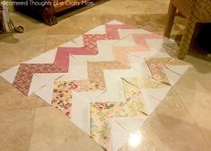 the quilts are laid out on the floor to make a chevroned pattern