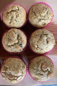 six muffins sitting on top of a wooden table